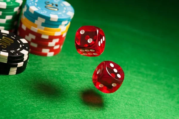 Three Card Poker live-dealer table showing player cards, dealer cards, and betting zones